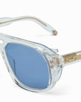 AKONI - "PHOENIX" in Crystal Clear Frames with Brushed 12k Gold w/Machine Silver Accents and Dusty Blue Lenses