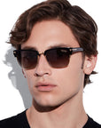 Tom Ford River square sunglasses in shiny black acetate with rose-gold accents and smoke polarized lenses.