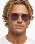 Square close-up of the model wearing Benny J sunglasses