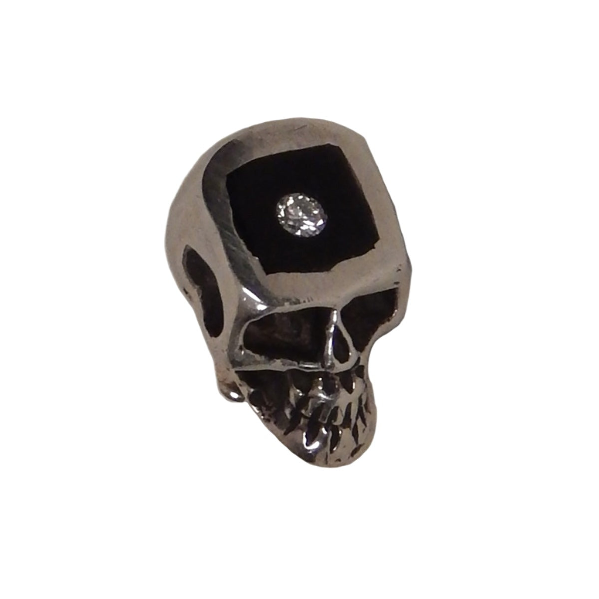 Los Angeles based Marcos, has designed this sterling silver skull tie pin with both an inlaid piece of black ebony wood as well as a bright white diamond accent.
