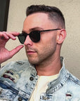 Garrett Leight - "KINNEY" Sunglasses in Matte Black Frames with Semi-Flat Blue Smoke Lenses