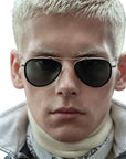 Model with blonde short hair looking at the camera wearing the Mr. Leight ICHI Sunglasses with a white background