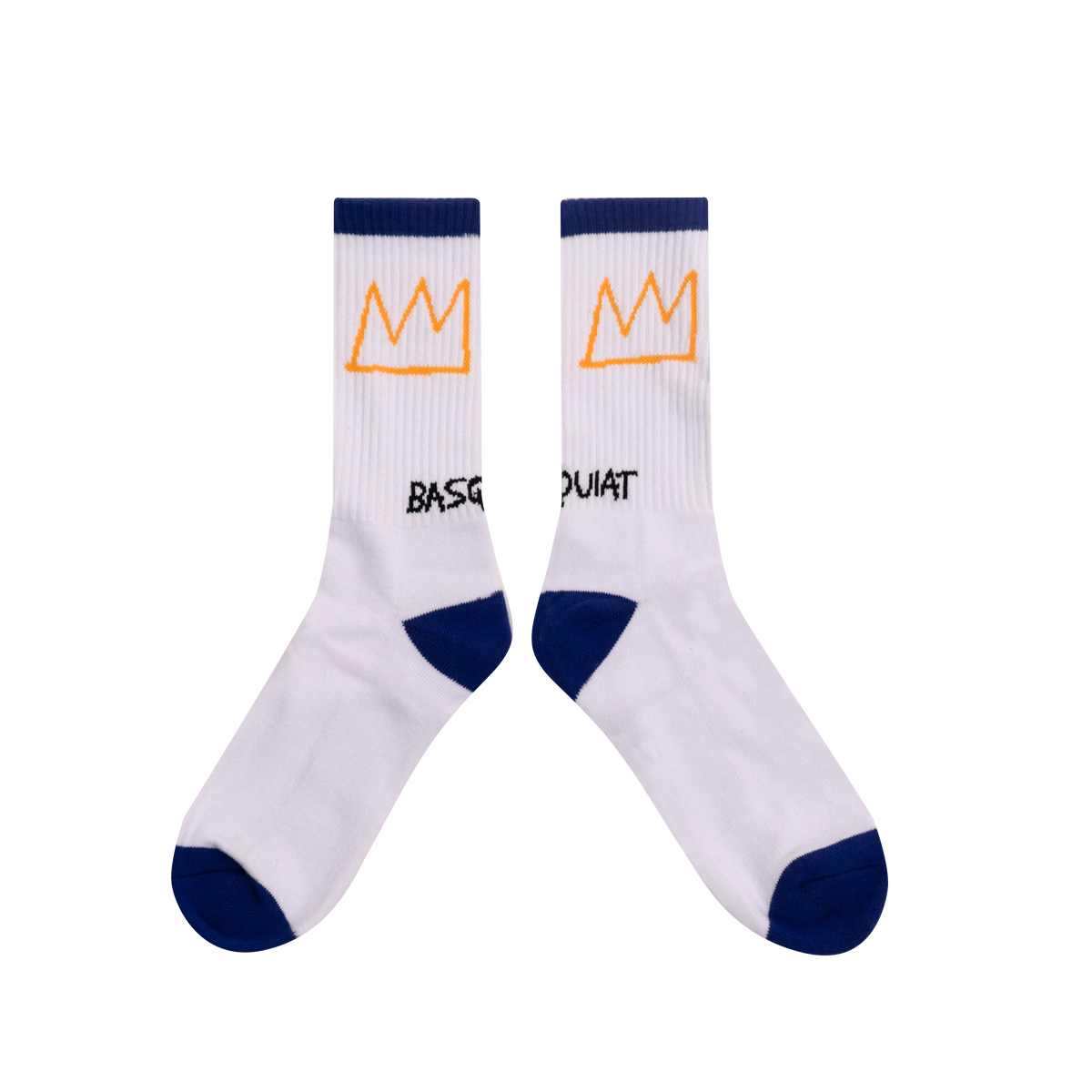 A pair of white crew socks with navy blue heels, toes, and ribbed cuffs, featuring an orange crown logo and the word 'BASQUIAT' printed in black.