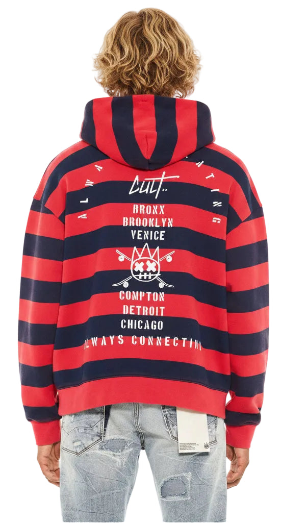 Red and navy striped hoodie with text and graphics on the back, worn by a person.