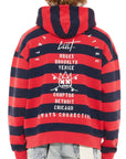 Red and navy striped hoodie with text and graphics on the back, worn by a person.
