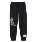 Black Rome Pays Off Basquiat ‘Pez Dispenser’ sweatpants with crowned dinosaur artwork and woven lower-leg label.