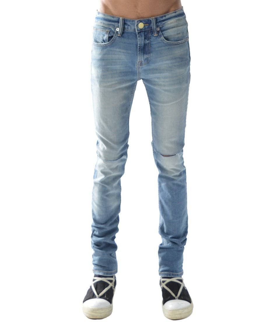 Model wearing the HVMAN-STRAT light blue super skinny distressed jeans facing the camera