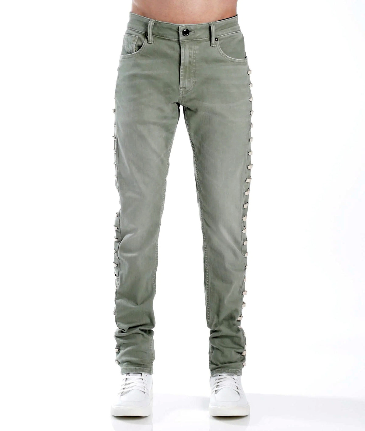 Green distressed jeans on a white background