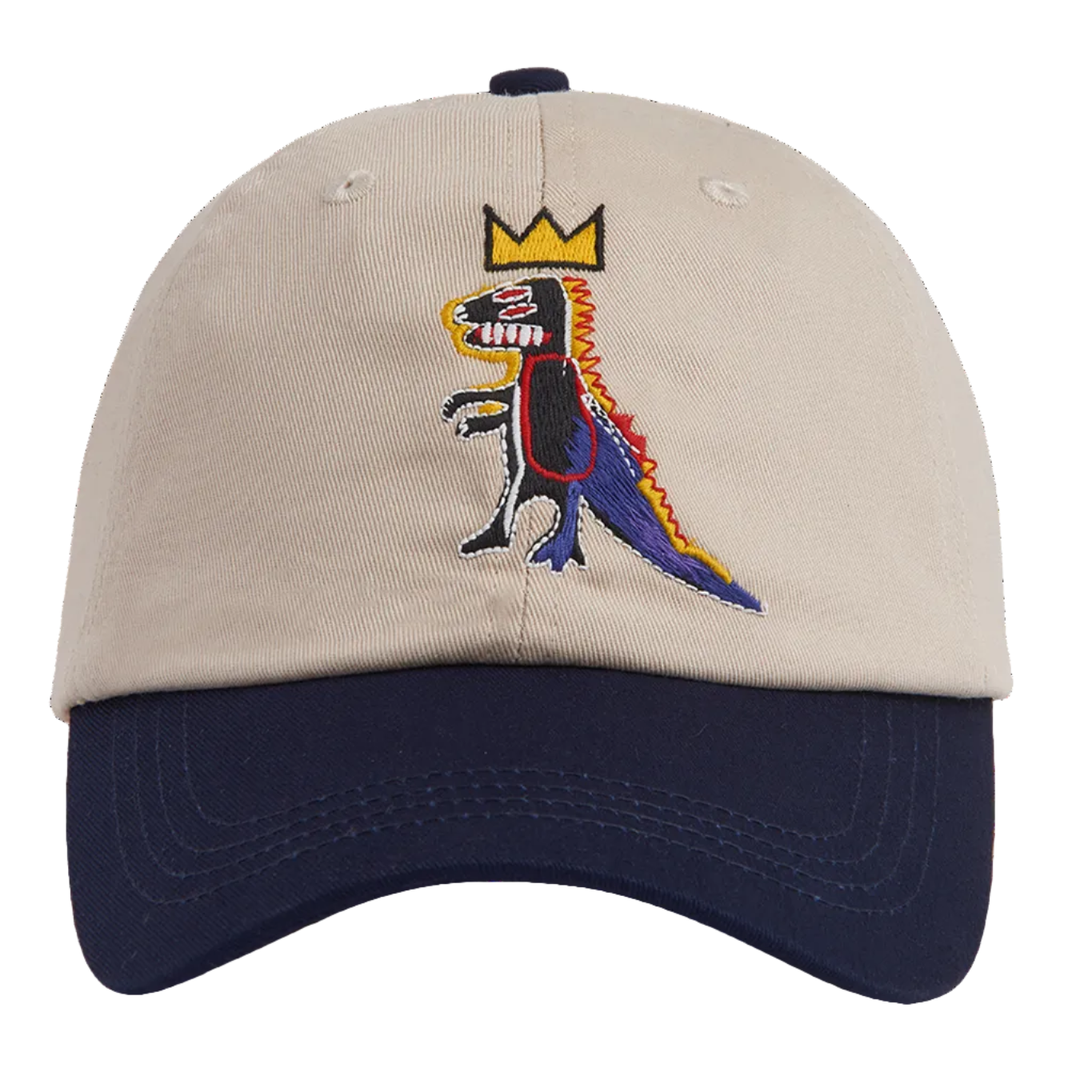 A structured baseball cap with a beige crown and a navy blue curved brim, featuring an embroidered cartoon dinosaur wearing a gold crown on the front.