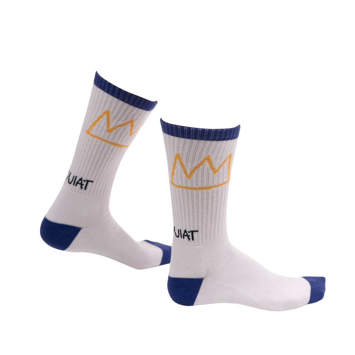 Angled view of Rome Pays Off Basquiat "Crown" crew socks showing ribbed white knit, gold crowns, and blue heels and toes.