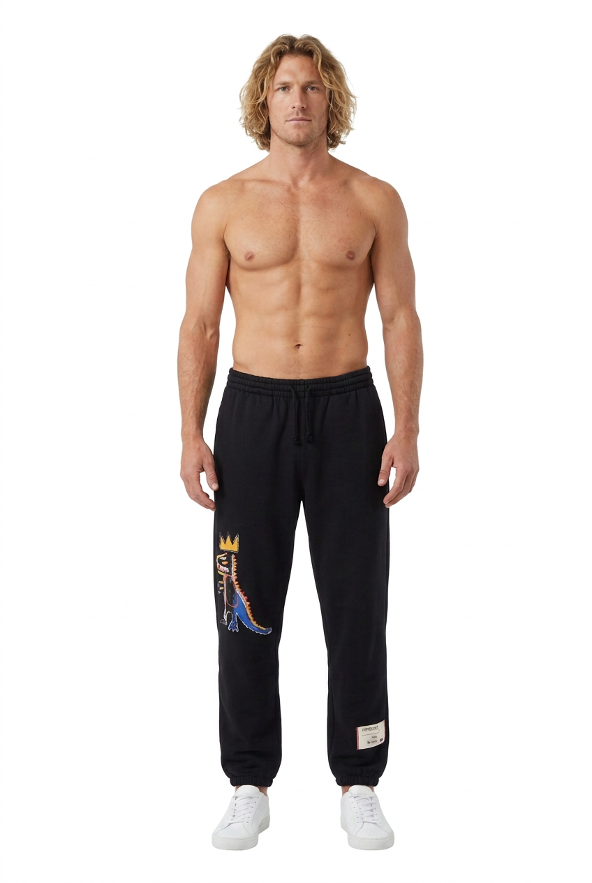 Blond male model wearing the Basquiat sweatpants on a pure white background