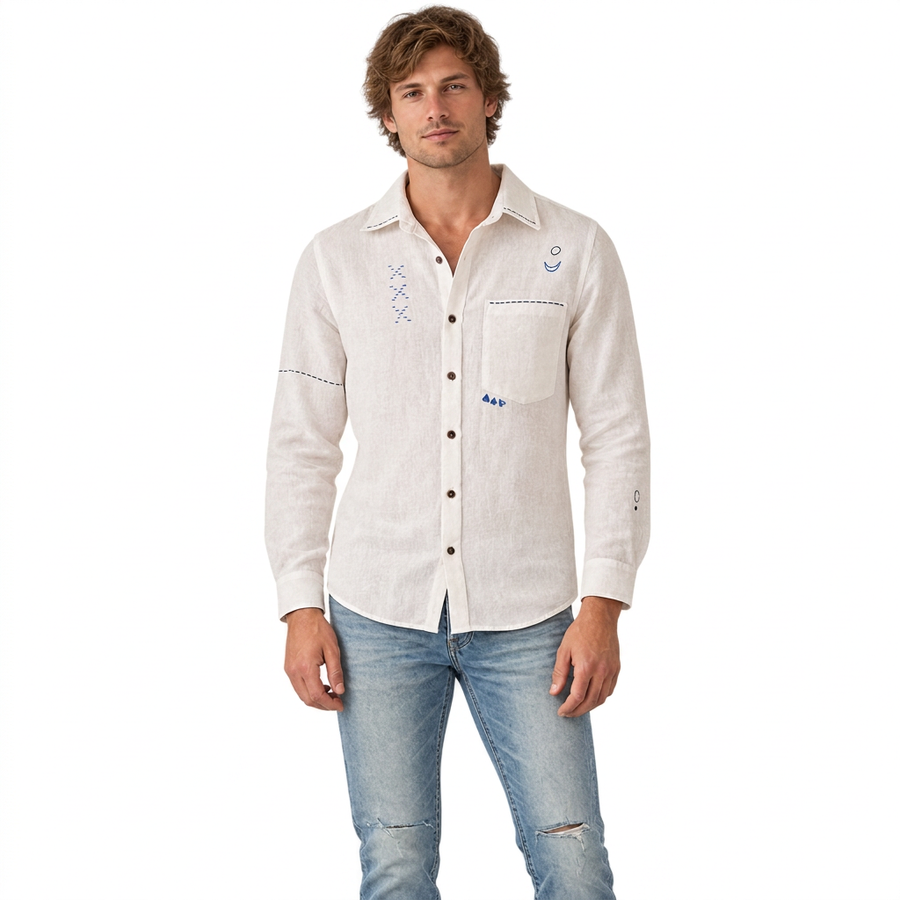 Front view of model wearing Live Linen "Atticus" embroidered shirt in Angora White with light blue jeans