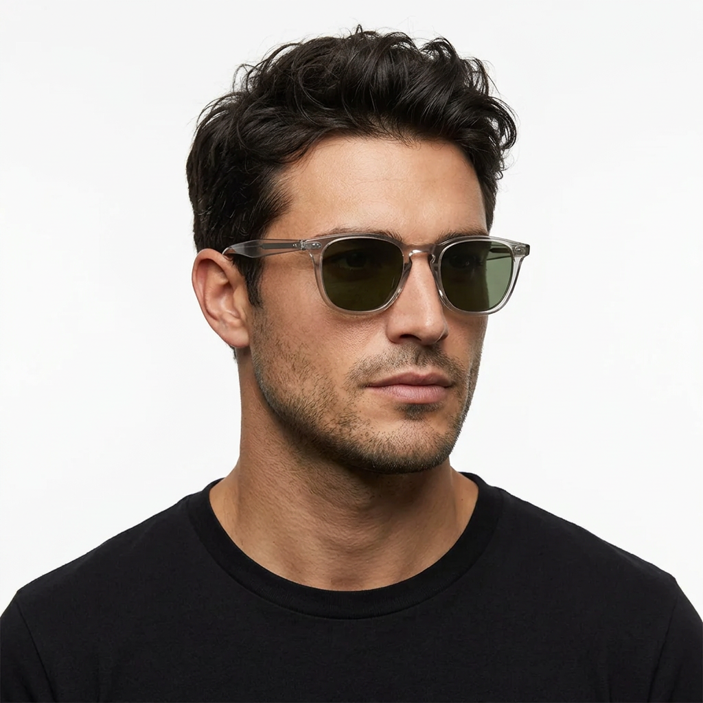 Dark-haired male model wearing Garrett Leight Brooks sunglasses with Light Light Grey frames and Pure G15 lenses on a white background