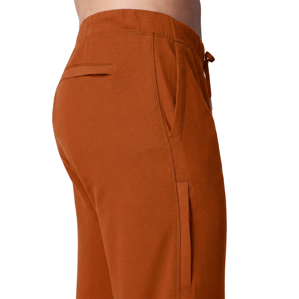 Mack Weldon ACE sweatpants in Rust, on-model side detail